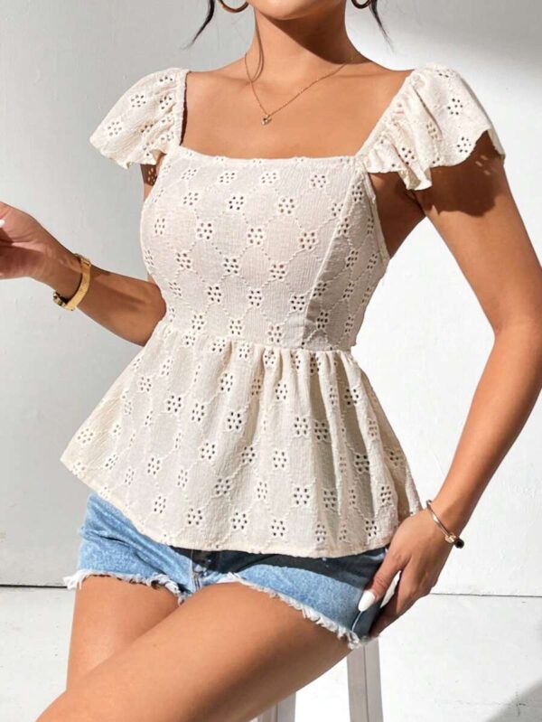 Blusa con olanes y espalda semidescubierta. Talla XS