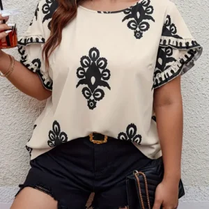 Elegante blusa con manga de petalo y estampado étnico.